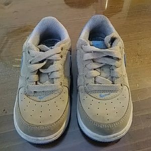 Tan and‎ blue nike hard bottom shoes